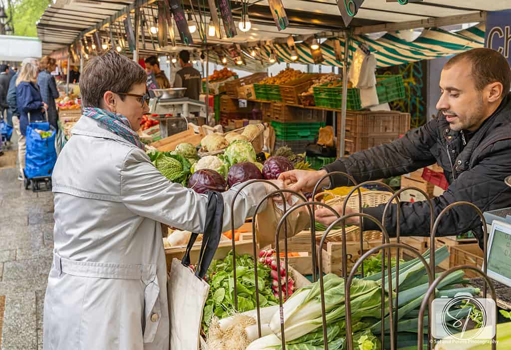 Andi Buying Radishes at the Bastille Farmers Market in Paris