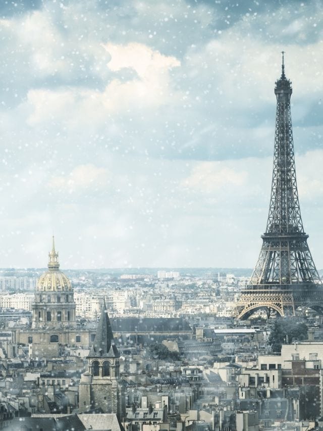 eiffel tower in light snow