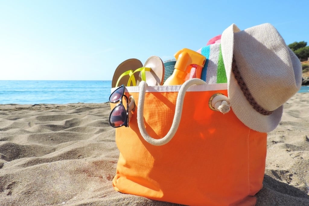 Get A Spacious Bag loaded beach bag on the sand