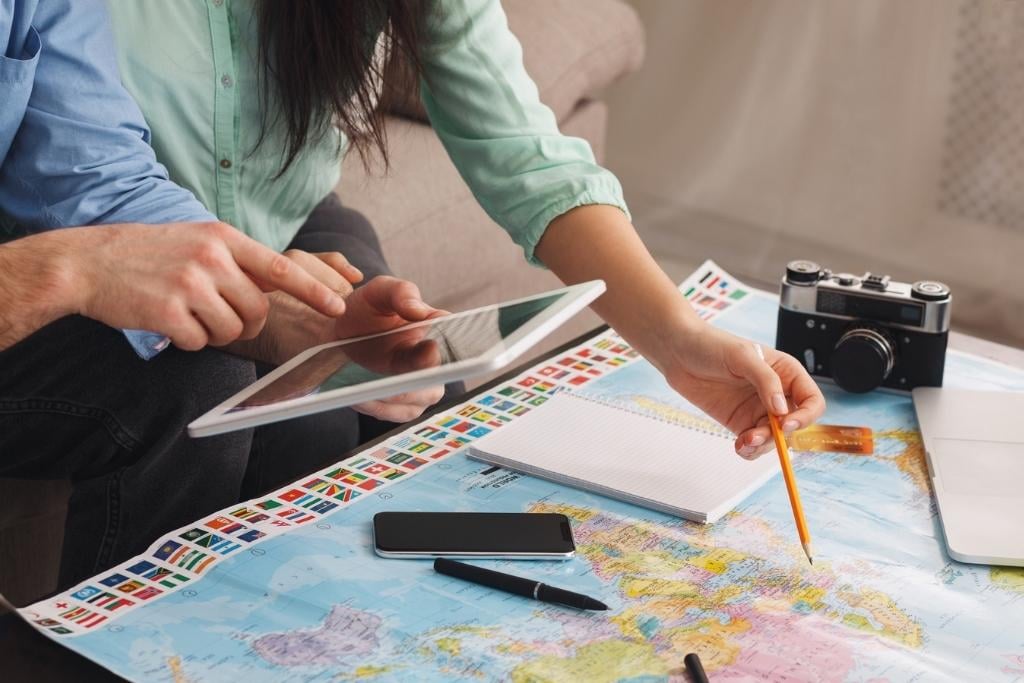 man and woman planning a trip