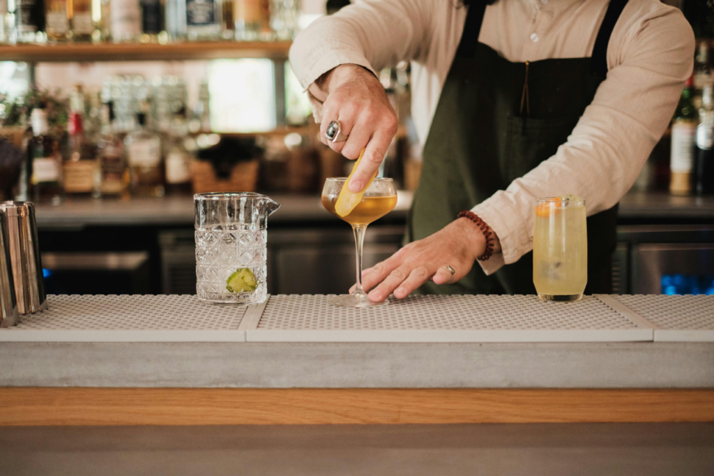 barman preparing a cocktail lemon